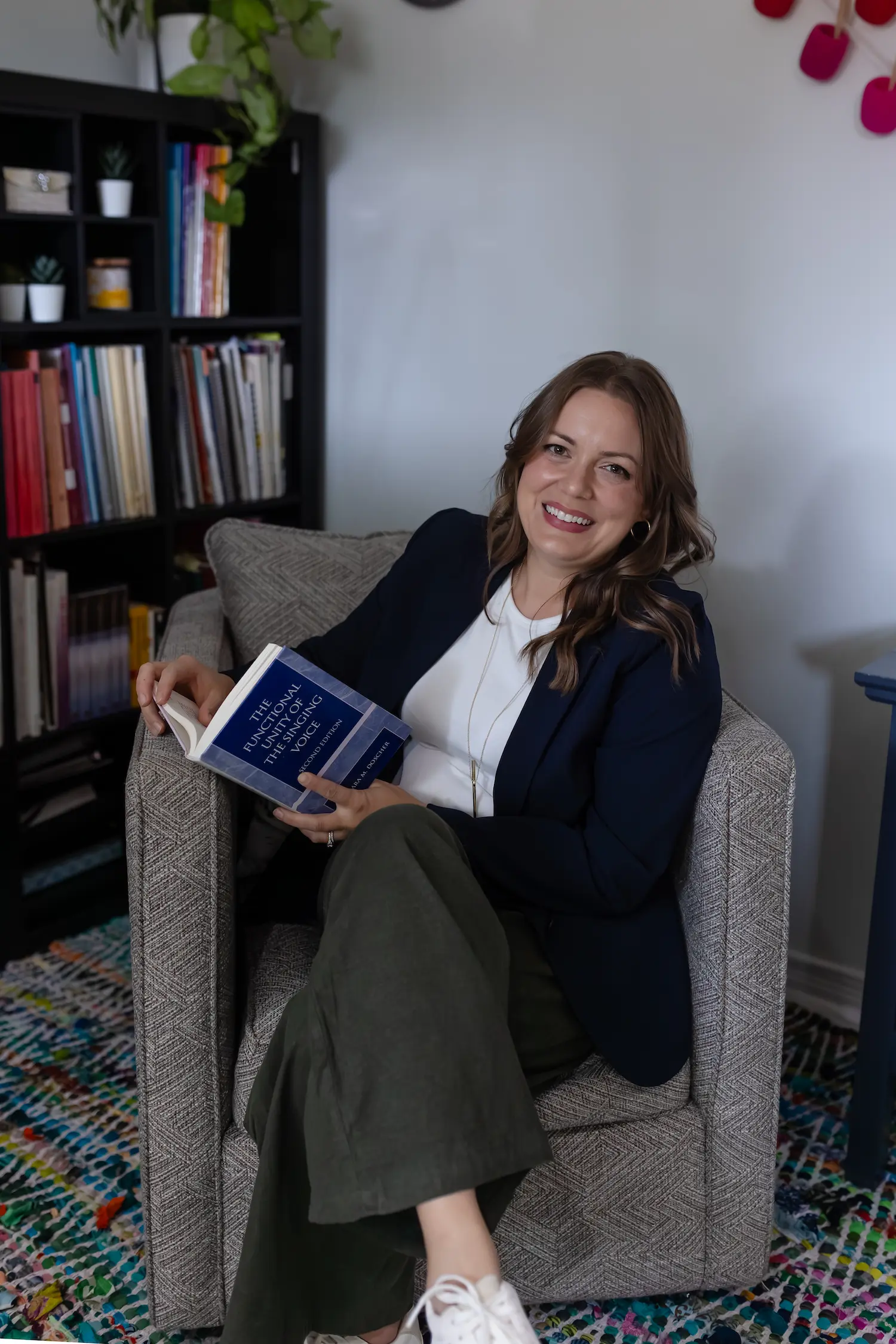 NewSong Academy London Ontario Voice Lessons Teacher Suzanne Schaafsma in her studio researching ways to help each of her students reach their full potential.